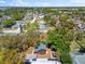 An aerial perspective showcasing a charming home nestled within a vibrant, tree-filled neighborhood at 6811 6Th W St, Bradenton, FL 34207
