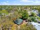 Aerial view of charming home with lush greenery and neighborhood views at 6811 6Th W St, Bradenton, FL 34207