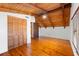 Bedroom featuring wood floors, ceiling fan, exposed ceiling beams and a closet at 6811 6Th W St, Bradenton, FL 34207