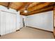 Bedroom with carpet flooring, natural wood beam ceilings and closet space at 6811 6Th W St, Bradenton, FL 34207