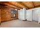 Neutral bedroom with carpet flooring and natural wood beam ceilings at 6811 6Th W St, Bradenton, FL 34207