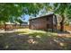 Exterior elevation of a log-sided two-story home with backyard at 6811 6Th W St, Bradenton, FL 34207