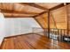 View from the upstairs hallway with wooden floors and wood beamed ceilings at 6811 6Th W St, Bradenton, FL 34207