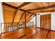 Wood floors on the second floor, wood beams, and railing in the hallway at 6811 6Th W St, Bradenton, FL 34207