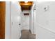 Bright hallway featuring tile flooring, white walls and wood beam ceilings at 6811 6Th W St, Bradenton, FL 34207