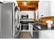 Well-equipped kitchen boasts stainless steel appliances, sleek black countertops, and white cabinetry at 6811 6Th W St, Bradenton, FL 34207