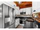 Well-equipped kitchen boasts stainless steel appliances, sleek black countertops, and white cabinetry at 6811 6Th W St, Bradenton, FL 34207