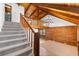 Spacious living room with vaulted wood ceilings, natural light, staircase and an elegant chandelier at 6811 6Th W St, Bradenton, FL 34207
