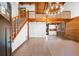 Spacious living room with high ceilings, wood beams, and staircase at 6811 6Th W St, Bradenton, FL 34207