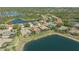 A lakefront home surrounded by lush greenery providing serene living and beautiful views at 6915 Honeysuckle Trl, Lakewood Ranch, FL 34202