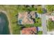 Overhead view of a home with a tile roof, screened pool and landscaping at 6915 Honeysuckle Trl, Lakewood Ranch, FL 34202