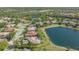 Enjoy lakefront living in this home with beautiful landscaping providing serene outdoor lifestyle at 6915 Honeysuckle Trl, Lakewood Ranch, FL 34202