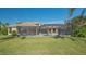 Large backyard with screened in pool and patio on a sunny day at 6915 Honeysuckle Trl, Lakewood Ranch, FL 34202