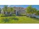Well-maintained home with lush landscaping, curb appeal, and a welcoming entrance at 6915 Honeysuckle Trl, Lakewood Ranch, FL 34202