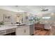Kitchen boasts stainless appliances, granite counters, pendant lighting, and hardwood flooring at 6915 Honeysuckle Trl, Lakewood Ranch, FL 34202