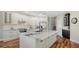 Kitchen features white cabinets, stainless steel appliances, and granite countertops at 6915 Honeysuckle Trl, Lakewood Ranch, FL 34202