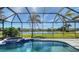 Relaxing screened pool area with an attached spa and beautiful lake views at 6915 Honeysuckle Trl, Lakewood Ranch, FL 34202