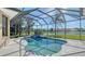 Sparkling pool and spa with screened-in enclosure, with beautiful lake views at 6915 Honeysuckle Trl, Lakewood Ranch, FL 34202