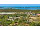 Breathtaking aerial view showcasing waterfront properties with ocean views and lush landscaping at 7713 Fairway Woods Dr # 902, Sarasota, FL 34238