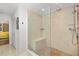 Walk-in shower with tiled bench, showcasing modern bathroom design and accessibility at 7713 Fairway Woods Dr # 902, Sarasota, FL 34238