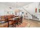 Dining room with view of staircase, hardwood floors, area rug, and stylish decor at 7713 Fairway Woods Dr # 902, Sarasota, FL 34238
