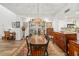 Well-lit dining room featuring a large wooden table, an elegant chandelier, and beautiful decor at 7713 Fairway Woods Dr # 902, Sarasota, FL 34238