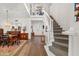 Bright foyer with staircase and high ceilings, complemented by hardwood floors and elegant decor at 7713 Fairway Woods Dr # 902, Sarasota, FL 34238