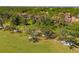 Scenic golf course view with mature trees and white sand traps surrounding beautiful real estate at 7713 Fairway Woods Dr # 902, Sarasota, FL 34238