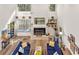 Spacious living room with fireplace, built-in shelving, and floor-to-ceiling windows for natural light at 7713 Fairway Woods Dr # 902, Sarasota, FL 34238
