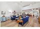 Large living area with lots of natural light, wood floors and a staircase at 7713 Fairway Woods Dr # 902, Sarasota, FL 34238