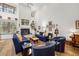 Light-filled living area features a fireplace, vaulted ceiling, and hardwood floors at 7713 Fairway Woods Dr # 902, Sarasota, FL 34238