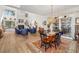 Open-concept living and dining areas boast high ceilings, hardwood floors, and large windows at 7713 Fairway Woods Dr # 902, Sarasota, FL 34238