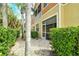 Private backyard with lush greenery and decorative plants providing a serene outdoor space at 7979 Limestone Ln # 14-101, Sarasota, FL 34233