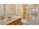 Bathroom featuring a glass-enclosed shower, modern vanity, and tile flooring for a clean and stylish space at 7979 Limestone Ln # 14-101, Sarasota, FL 34233