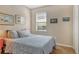 Cozy bedroom with a comfortable bed, window, and neutral decor for a relaxing atmosphere at 7979 Limestone Ln # 14-101, Sarasota, FL 34233