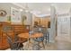 Cozy dining room adjacent to the kitchen, featuring wooden furniture and ample natural light at 7979 Limestone Ln # 14-101, Sarasota, FL 34233
