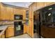 Kitchen showcasing stainless steel appliances, ample cabinetry, and durable countertops for easy meal preparation at 7979 Limestone Ln # 14-101, Sarasota, FL 34233
