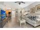 Bright living room featuring tile flooring, neutral walls, and modern furnishings perfect for relaxing and entertaining at 7979 Limestone Ln # 14-101, Sarasota, FL 34233