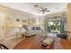 Comfortable living room with access to a screened-in patio, ideal for indoor-outdoor living at 7979 Limestone Ln # 14-101, Sarasota, FL 34233