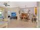 Comfortable living room with tile flooring, fan, and sliding doors to the outdoor patio at 7979 Limestone Ln # 14-101, Sarasota, FL 34233