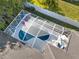 Aerial view of a screened-in pool and sunshade area within a fenced-in backyard at 826 Oak Briar Ln, Osprey, FL 34229
