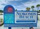 Nokomis Beach sign with information on refreshments and restrooms at a Sarasota County park at 826 Oak Briar Ln, Osprey, FL 34229