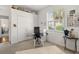 Bright bedroom with a ceiling fan and window at 826 Oak Briar Ln, Osprey, FL 34229