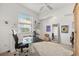 Bright bedroom with a ceiling fan and window at 826 Oak Briar Ln, Osprey, FL 34229