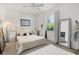 Bright bedroom with a ceiling fan and window and closet for storage at 826 Oak Briar Ln, Osprey, FL 34229