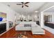 Comfortable living room with a view into the kitchen, showcasing an open and connected living space at 826 Oak Briar Ln, Osprey, FL 34229