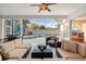 Inviting screened-in patio with comfortable seating overlooking a private pool and well-kept backyard at 826 Oak Briar Ln, Osprey, FL 34229