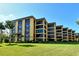 Low-angle view of building at 8779 Midnight Pass Rd # 106H, Sarasota, FL 34242
