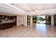 Large island kitchen leading to a comfortable outdoor patio area at 8779 Midnight Pass Rd # 106H, Sarasota, FL 34242