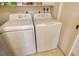 Laundry room equipped with a dryer and washing machine at 8779 Midnight Pass Rd # 106H, Sarasota, FL 34242